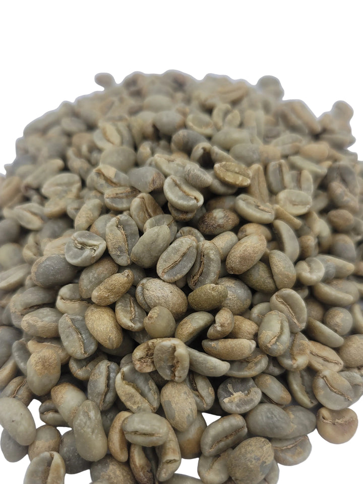 Unroasted green coffee beans on a white background