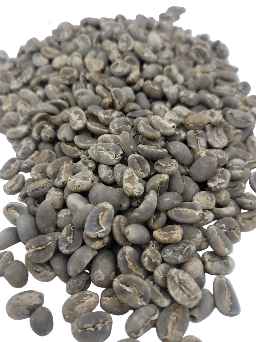 Pile of green coffee beans on a white background