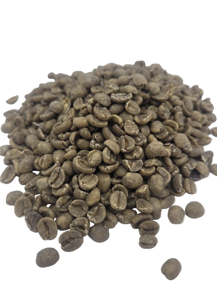 Pile of green coffee beans on a white background