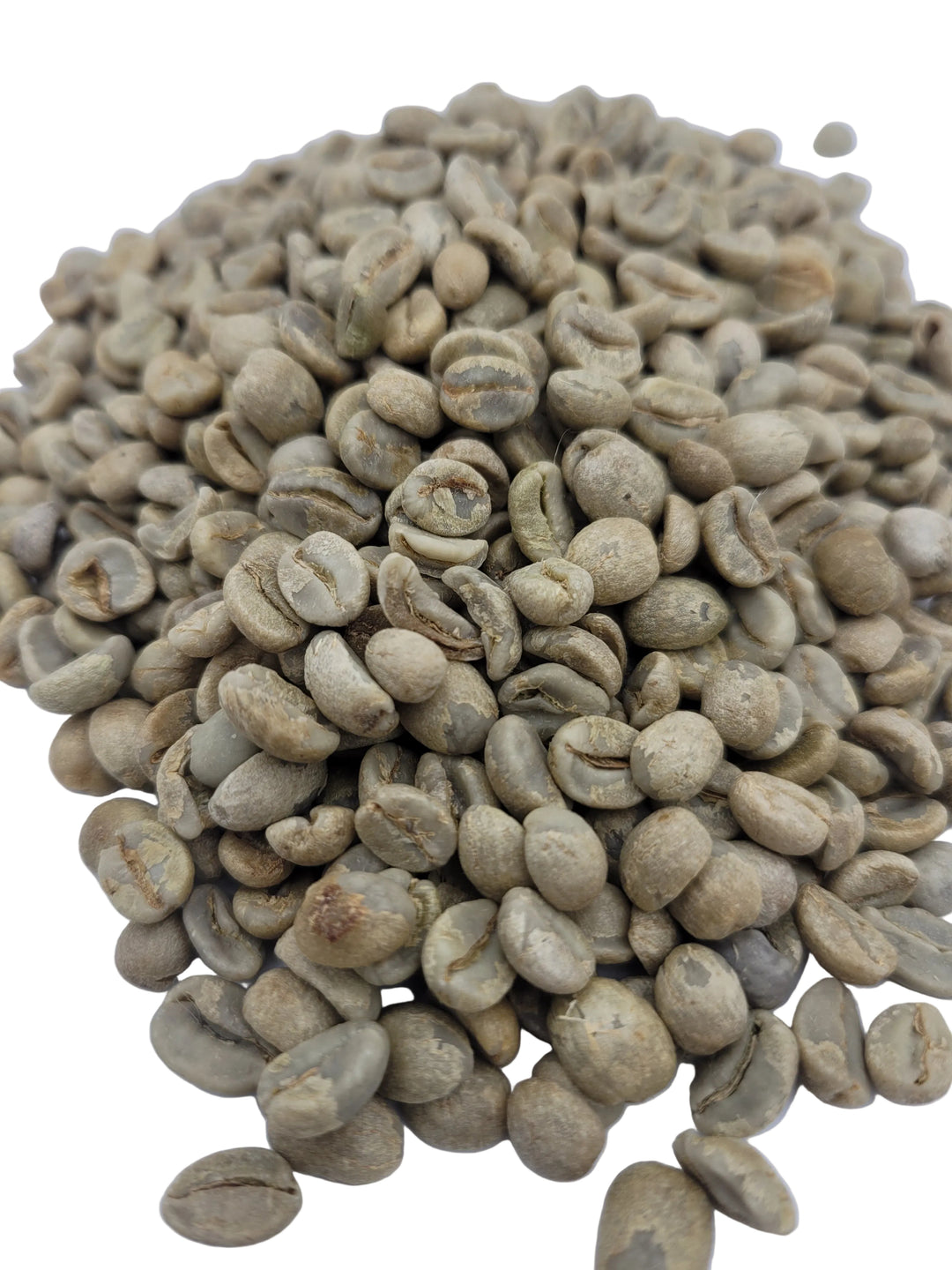 Close-up of green coffee beans on a white background