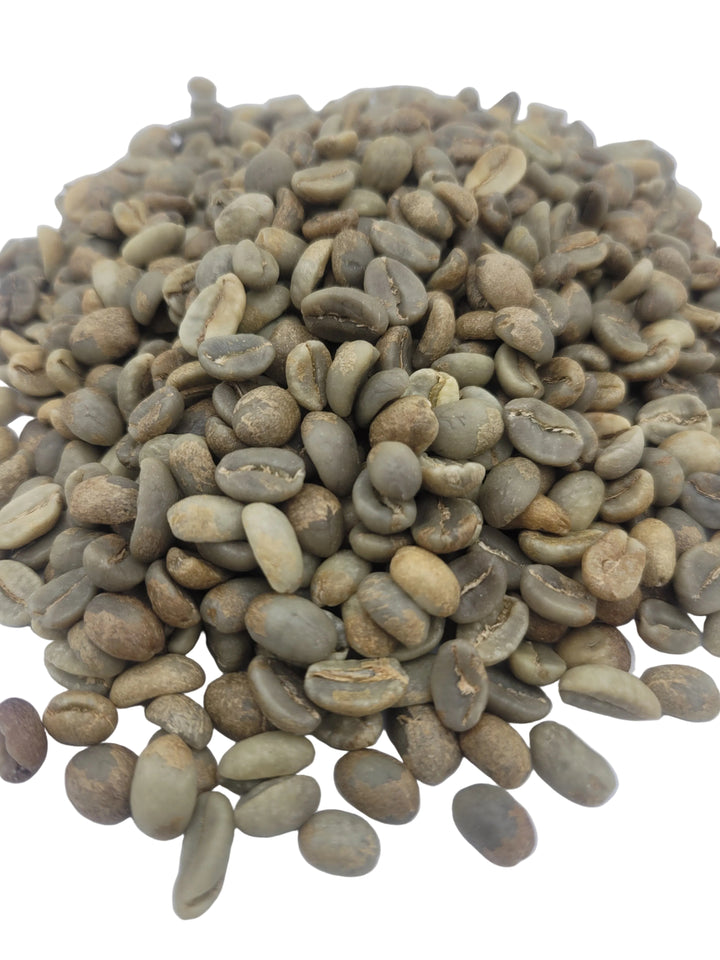 Pile of green coffee beans on a white background